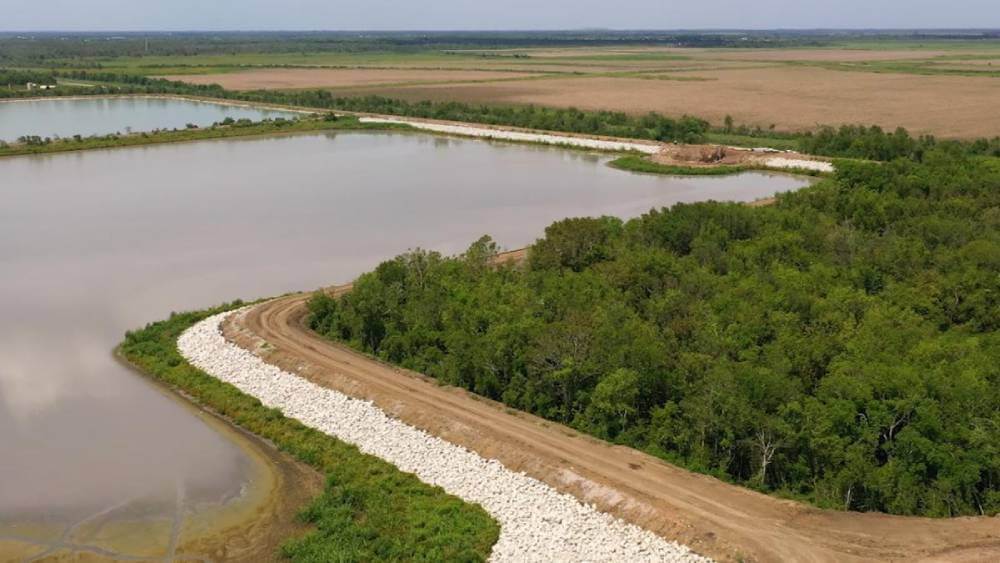 Aerial vegetation management on an earthen dam embankment